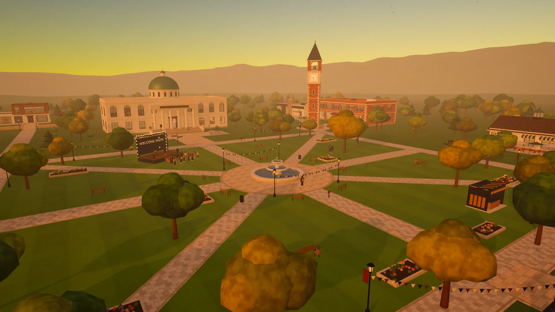 D2D University at golden hour from above: the domed hall, the clock tower, the fountain on the quad and autumn trees along the paths.